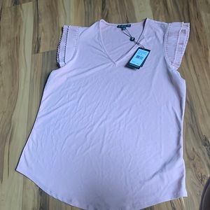 Super soft flutter sleeve with curve bottom.